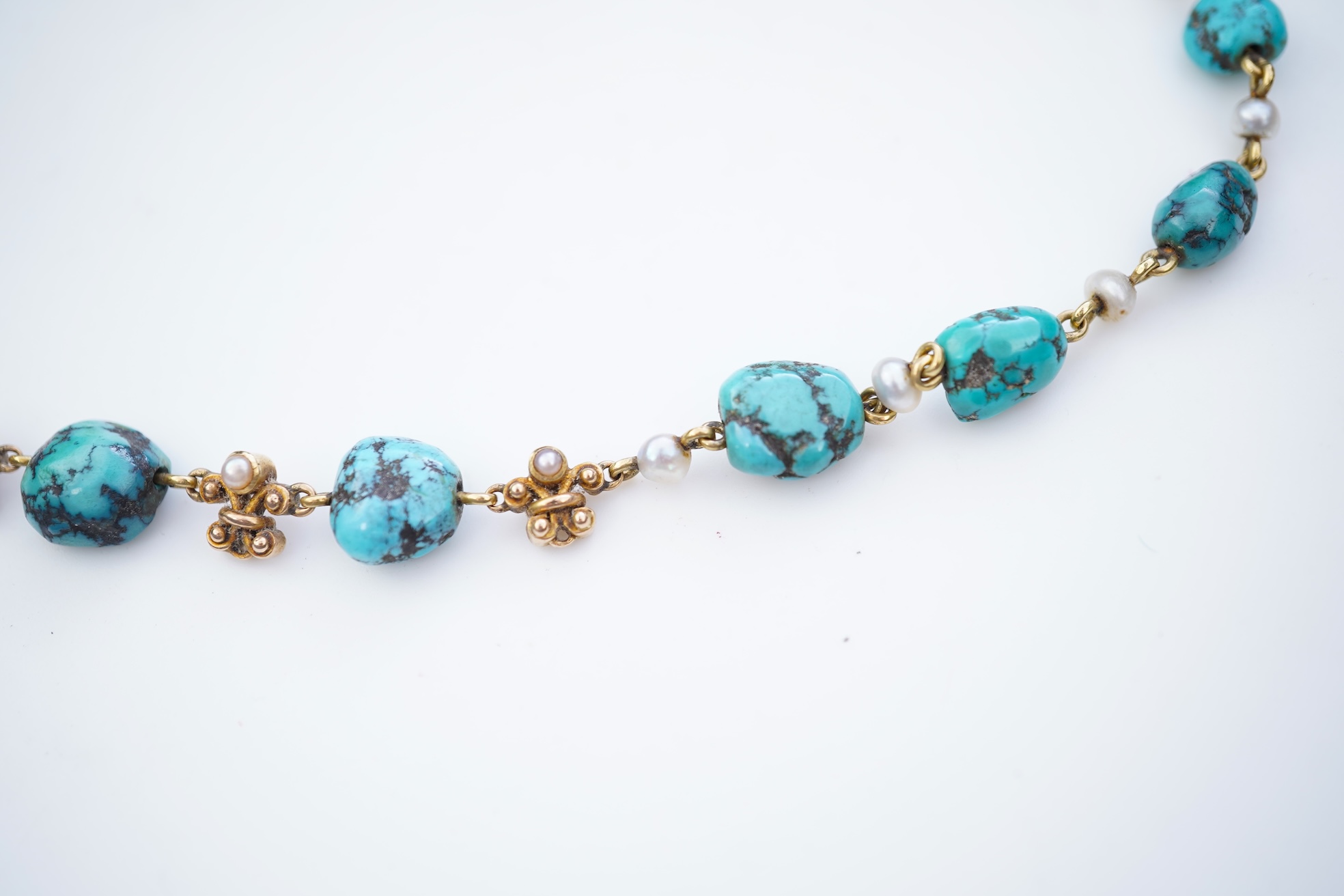 A turquoise and seed pearl necklace, early 20th century
